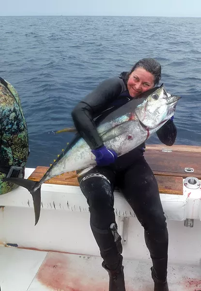 Brandi Easter and her freshly speared yellowfin tuna in Panama in April of 2017. - COURTESY OF BRANDI EASTER