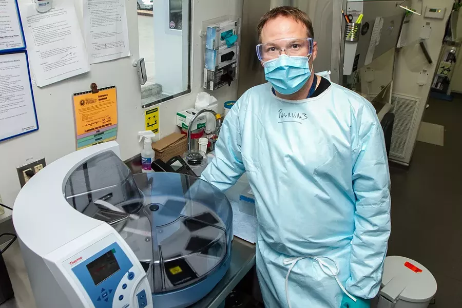 Humboldt County Public Health Laboratory Manager Jeremy Corrigan and microbiologist Annayal Yikum in the lab. - COURTESY OF PUBLIC HEALTH