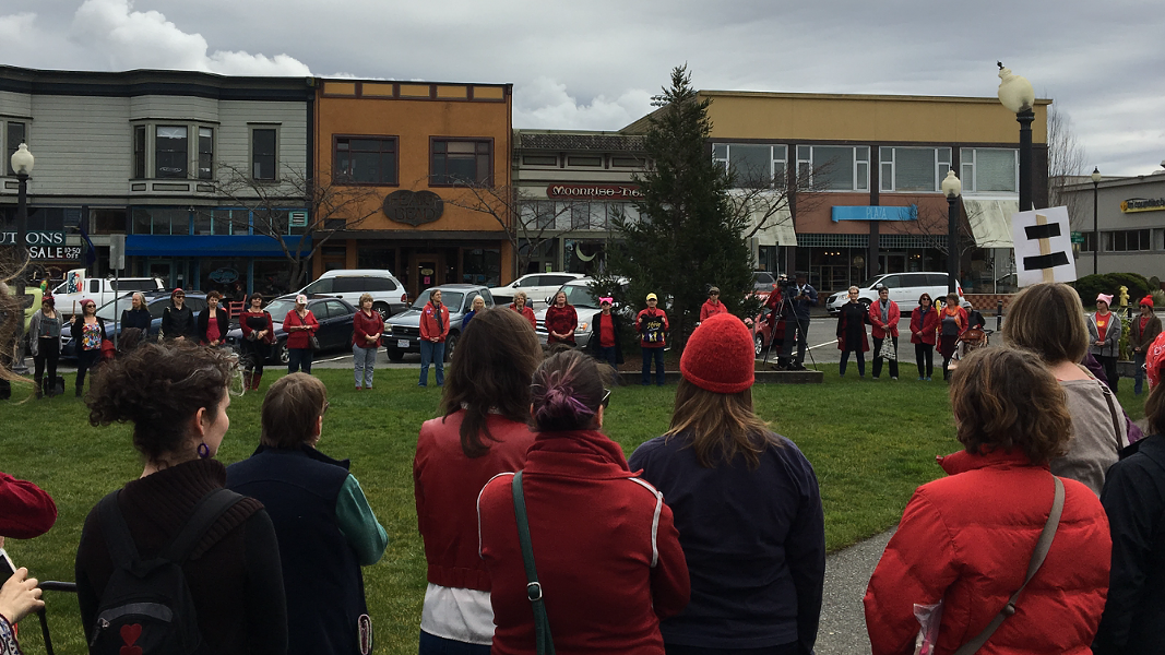 The widening circle on the Arcata Plaza on International Women’s Day. - PHOTO BY PERI ESCARDA