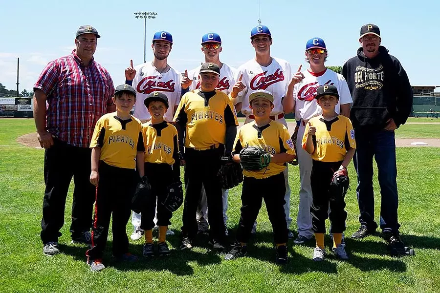 Crabs players pose with Crescent City Pirates on Little League Sunday - MATT FILAR