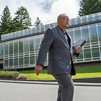New Humboldt State University President Tom Jackson Jr. strolls across campus on June 28, his first day on the job.