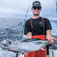 William Justesen, of Carlotta, holds an Albacore tuna caught Monday while fishing off of Trinidad.