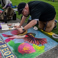 Chalk artist Jaimal Kordeswas brushed the finishing touches on this hummingbird portrait for his panel sponsored by Ink People Center for the Arts.
