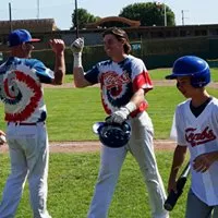 Pitching Coach Eric Giacone congratulates Jackson Kritch. - MATT FILAR