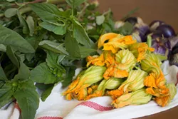 PHOTO BY H&Eacute;CTOR ALEJANDRO ARZATE - Amaranth greens, or quintoniles and flor de calabaza, squash blossoms, from the farmers market.