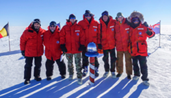 Parts Unknown crew at the South Pole. Ferrell is in the center with Bourdain to his left. Feb. 2, 2017. Photo courtesy Josh Ferrell.