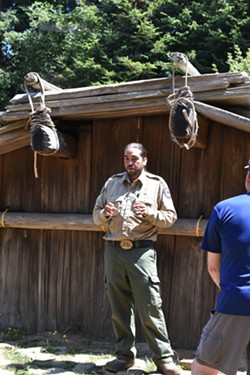 State Park Interpreter leads visitors on a guided tour of Sumeg Village. - Uploaded by media!1