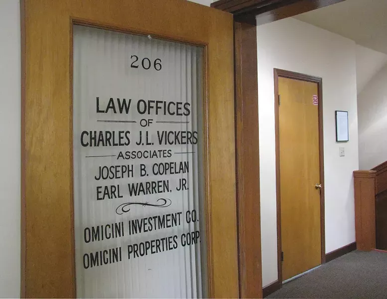When Architect Jack Freeman remodeled the upstairs of the Omicini Building—310 F St., Eureka—for the North Coast Journal offices, he left the original mahogany doors and lettering in place. - PHOTO BY HOLLY HARVEY