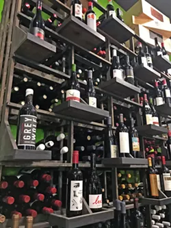 WALL OF VINO 15 Degrees C Wine Shop and Bar will have just the bottle you need. Simply ask owner/sommelier Ali Rush Carscaden for a recommendation from her beautifully curated selection of local and imported wines. - PHOTOS BY BETH GIUFFRE