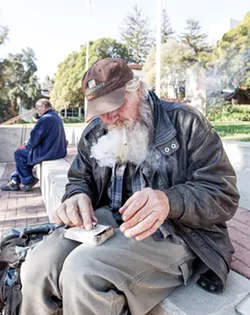 PACK IT UP Police are moving homeless residents out of areas that are being more frequented by SLO's housed population during the COVID-19 pandemic. - PHOTO BY JAYSON MELLOM