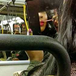 LABIOS Poet and photographer Marisela Norte's images capture the fashion and colors of the Latino community, such as a woman applying lip gloss while in transit. - PHOTOS COURTESY OF STUDIOS ON THE PARK