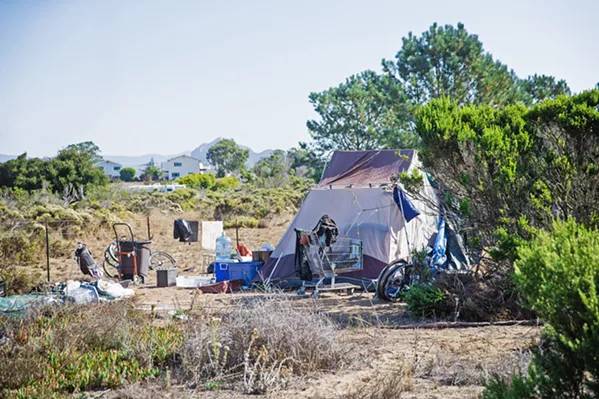 MOVE ALONG A small homeless encampment near the Los Osos library will be cleared out by the county this month. - PHOTO BY JAYSON MELLOM