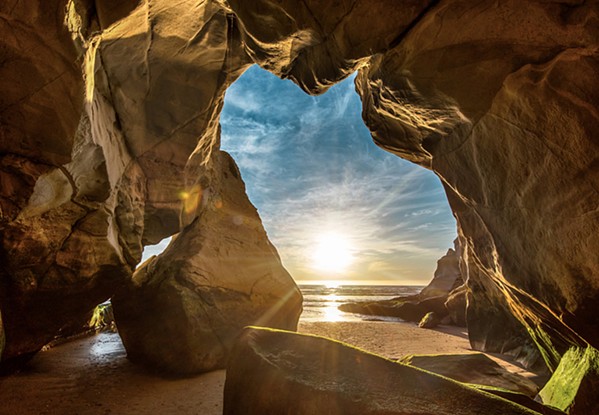 CAVE OF WONDERS Arroyo Grande photographer Amy Joseph, owner and founder of Central Coast Pictures Fine Art Photography, is using her 2021 calendar to highlight several destinations throughout SLO County, including the sea caves of Pismo Beach. - COURTESY PHOTO BY AMY JOSEPH