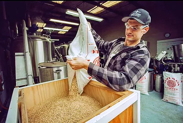 GRAIN FOR MASH Colony Mash Brewing Co. owner/brewer Erik Knapp gets the grain ready to go into the kettle. - PHOTOS COURTESY OF COLONY MASH BREWING CO. INSTAGRAM