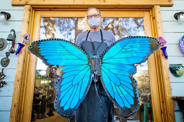 WINGED BEAUTY Artist Larry Le Brane shows off his latest butterfly creation as part of the Veterans Voices' Wings of Change installation. - PHOTO BY JAYSON MELLOM