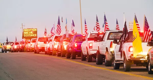 READY TO RIDE Trucks line up outside the entry to the Oceano Dunes SVRA on Oct. 30, the first day vehicles were allowed in the park after a seven-month closure. - FILE PHOTO BY JAYSON MELLOM