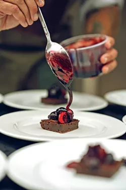 SWEET DREAMS Chef Matthew Roberts caps off the evening meal at Covell Ranch with a dark chocolate and espresso torte drizzled with syrah reduction. - COURTESY PHOTO BY HM IMAGERY/HUGO MARTINEZ