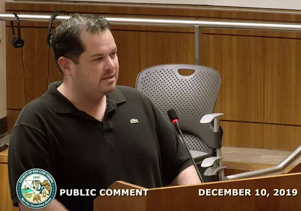 PLEADING GUILTY Helios Dayspring, pictured, lobbies the SLO County Board of Supervisors at a meeting in 2019. Dayspring, founder of Natural Healing Center, pleaded guilty last month to bribing late 3rd District Supervisor Adam Hill between 2016 and 2019. - SCREENSHOT FROM SLO COUNTY BOARD OF SUPERVISORS MEETING