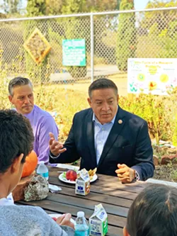 FEEDING THE FUTURE U.S. Rep. Salud Carbajal sits with Laguna Middle School students as they enjoy a free lunch, thanks to American Rescue Plan Act funding. Principal John Calandro sits to Carbajal's left. - PHOTO BY MALEA MARTIN