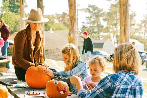 HARVEST FEST Camp Ocean Pines in Cambria is hosting a free Harvest Festival on Halloween. Kids and adults are invited to decorate pumpkins (pictured), practice archery, sip wine, and more on the 13-acre campus. - PHOTO COURTESY OF CAMP OCEAN PINES