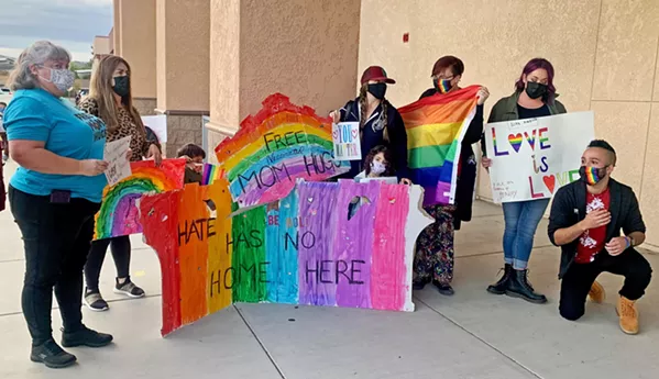 SHOWING SUPPORT Teachers welcome students and community members to the Paso Robles High School performing arts center on Oct. 20, where students organized a Coming Out Against Hate forum. - PHOTO BY MALEA MARTIN