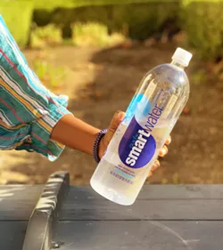 IN THE BLUE BIN No. 1 and 2 plastics are recyclable in SLO County. A good rule of thumb for what falls into these categories are items with bottlenecks, including plastic water bottles, milk jugs, empty laundry detergent, and soda bottles. - PHOTO BY MALEA MARTIN
