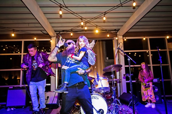 IT'S A FAMILY AFFAIR Hip-hop/rap winner Rogue Status and frontman RoAch Clip brought the kids to the stage as they crafted beats and spewed rhymes.  - PHOTO BY JAYSON MELLOM