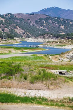 DRIED OUT, AGAIN SLO County entered another drought in 2021, with reservoirs like Lopez Lake dropping to alarmingly low capacities. - FILE PHOTO BY JAYSON MELLOM
