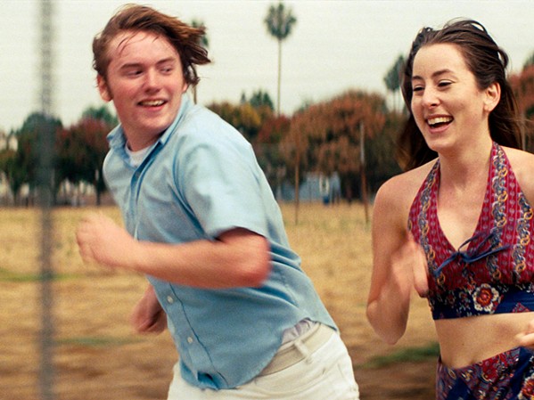 SHEER EXUBERANCE Gary (Cooper Hoffman, son of Philip Seymore Hoffman) and Alana (Alana Haim of the band Haim) make their feature-length debuts in Paul Thomas Anderson's Licorice Pizza, a love letter to the '70s and San Fernando Valley. - PHOTO COURTESY OF BRON STUDIOS AND FOCUS FEATURES
