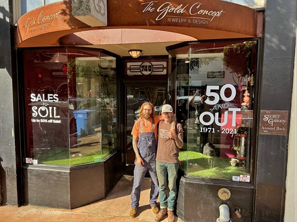 SALES TO SOIL Brothers and co-owners Aaron (left) and Devin (right) Gomez pose in front of their family-owned Higuera Street storefront, The Gold Concept, which closed on on Dec. 31, 2021, after 50 years in business. - PHOTO COURTESY OF AARON GOMEZ