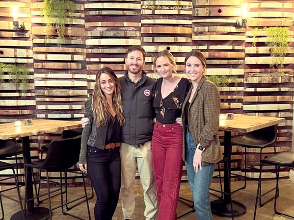 PASSIONATE ABOUT POURS Saints Barrel's launch team includes, from left, owners Sarah and Tyler Saldo, wine specialist Megan Szymanski, and marketing and assistant manager Lauren Ralston. - PHOTO COURTESY OF SAINTS BARREL WINE BAR