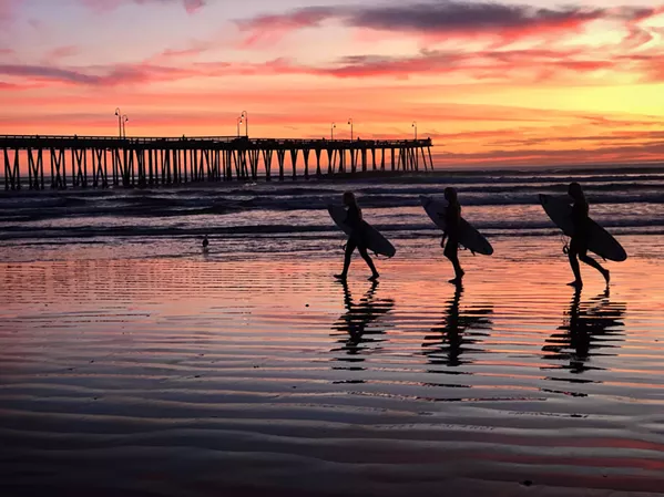 SERENE SUNSET "I'm really interested and fascinated with street photography these days," said Kathleen Gerber, although she feels the label sounds more appropriate for stills taken on a busy street in New York City, rather than while people-watching at Pismo Beach. "It's not quite the same, but you still find moments, you know?" - COURTESY PHOTO BY KATHLEEN GERBER