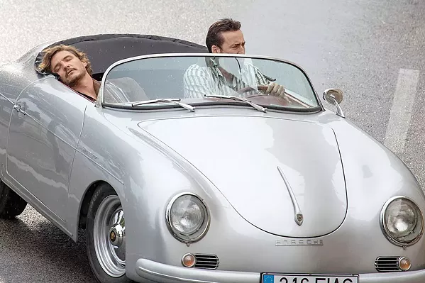 BESTIES? Nicholas Cage and Pedro Pascal star in the action comedy The Unbearable Weight of Massive Talent, in which Cage stars as himself hired to attend a billionaire fan's birthday party, leading to a wild weekend involving a drug cartel and the CIA. - PHOTO COURTESY OF LIONSGATE AND SATURN FILMS