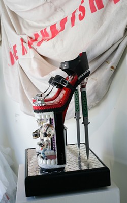 STILETTO HEELS Larry Le Brane repurposed two stiletto knives, fused glass drawer pulls, luggage straps, found objects, metal, and wood to create Towers of Bobble. - PHOTO BY GLEN STARKEY
