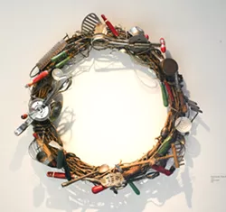 GEAR AND GADGETS Janet Smith’s wreath of vintage kitchen implements—Full Circle: Then & Now—features out-of-date mixers, graters, mashers, ladles, and more. - PHOTO BY GLEN STARKEY