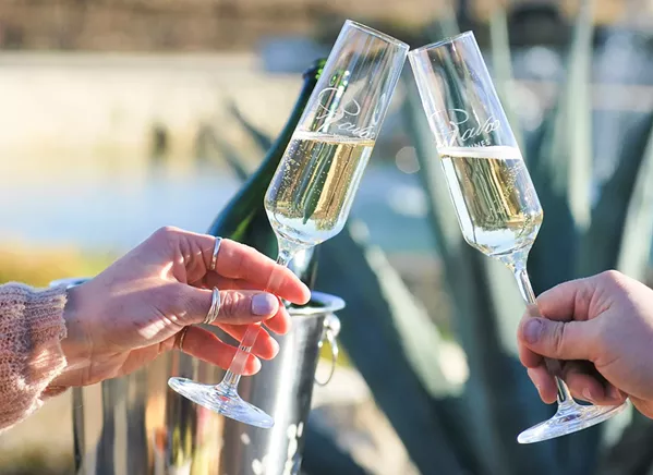 BUBBLY BECKONS Rava co-owners Chad and Lauren Rava and winemaker John Clark use traditional méthode champenoise techniques for their sparkling lineup, and they also craft still wines. - PHOTO COURTESY OF RAVA WINES AND EVENTS