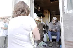 OUTSIDE LOOKING IN : A county code official informs Sunny Acres resident Peter Ray he’ll have to prepare to leave his trailer. - PHOTO BY STEVE E. MILLER