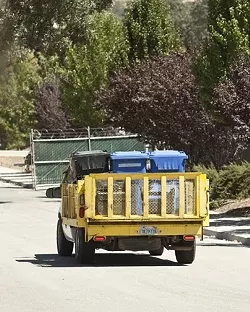 TRASHED: Mid State’s truck No. 10 was taken out of service by the CHP for violations including poor brake condition, loose rubber bushing fasteners on two axles, a worn tie rod end, a cracked maintenance frame, and an improperly mounted air hose. - PHOTO BY STEVE E. MILLER