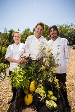 SO FRESH, SO GREEN:  From left to right, Gardens at Avila Baker Chelsea Freeland, Executive Chef Gregg Wangard, and Sous Chef Michael Avila are backed by the greenery of the restaurant&rsquo;s 1.5 acre onsite garden. With an abundance of fresh produce and herbs at his fingertips, Chef Wangard has free license to play up local dishes with vibrant abandon. - PHOTO BY HENRY BRUINGTON