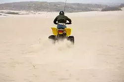 AMPLE SAND? : Depending on which side wins in court, a portion of the Oceano Dunes could continue to serve as an off-road playground or ecological buffer. Or the county could just settle before the decision comes down. - FILE PHOTO