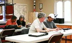MEETING OF THE MINDS: Learners and volunteers Nino Patricio, Sandy Chertok, Bob Rothermel, and Ruben Rodriguez (from left to right) meet at one of the learning centers in SLO County. - PHOTO COURTESY OF SLO LITERACY COUNCIL