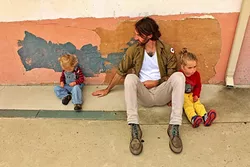 THE ART SHED LIFE: J Dave Montgomery loves to create bright, graphic pieces in his Santa Margarita shed. Sometimes his children Kieran and Jameson (pictured) join him with their own artistic projects. - PHOTO COURTESY OF J DAVE MONTGOMERY