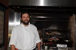 FLAMIN’: Chef Brian Collins brings a taste of Chez Panisse to South County in his new restaurant Ember where nearly everything is cooked over flaming oak. - PHOTO BY DAN HARDESTY