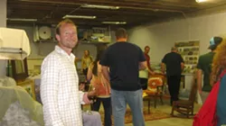 IT’S A PARTY : All these friendly people came out to support Matt Hedlund and Glenn Dean’s art. Can you blame the guy for looking so stoked? - PHOTO BY NICK POWELL