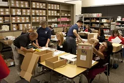 PAPER TRAIL : Democracy is sexy, there’s no doubt about it. But it also involves a lot of paperwork, with 40 volunteers spending about 160 hours counting ballots. - PHOTO BY STEVE E. MILLER