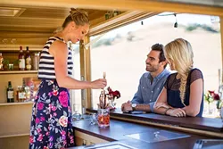 CRAFTY: Whiskey and Jun e co-owner Erin Green stirs up something fun. - PHOTO BY CAMERON INGALLS