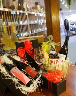 WINE GIFTS GALORE : Thanks to all the local wine shops, gift givers have a wide choice of items sure to please wine lovers. - PHOTO BY STEVE E. MILLER