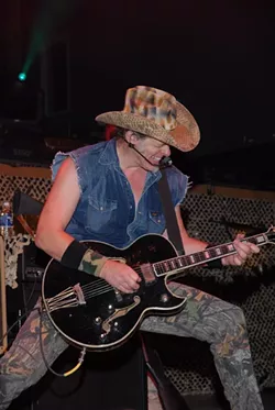 THE HUMAN TORNADO! BE SWEPT UP IN TED NUGENT’S RIPPING GUITAR AND RIGHTWING RHETORIC AT POZO SALOON ON JUNE 13. : Be swept up in Ted Nugent’s ripping guitar and rightwing rhetoric at Pozo Saloon on June 13. - PHOTO COURTESY OF DUANE SYCZ
