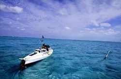 MODERN MAGELLAN : Jason Lewis, author of the The Expedition trilogy, leaves the Turks and Caicos islands in his pedal boat Moksha. - PHOTO BY KENNY BROWN