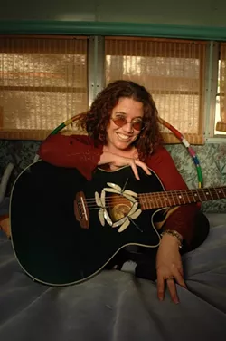 HIPPY HEART : The sweet and funny Americana singer-songwriter Rachel Sedacca rolls through town on May 21 to The Clubhouse, one stop on her West Coast tour. She’s endorsed by Florida-based Luna guitars and plays their beautiful “Dragonfly” acoustic guitar with mother of pearl inlay work. - PHOTO BY CMS PHOTOGRAPHY